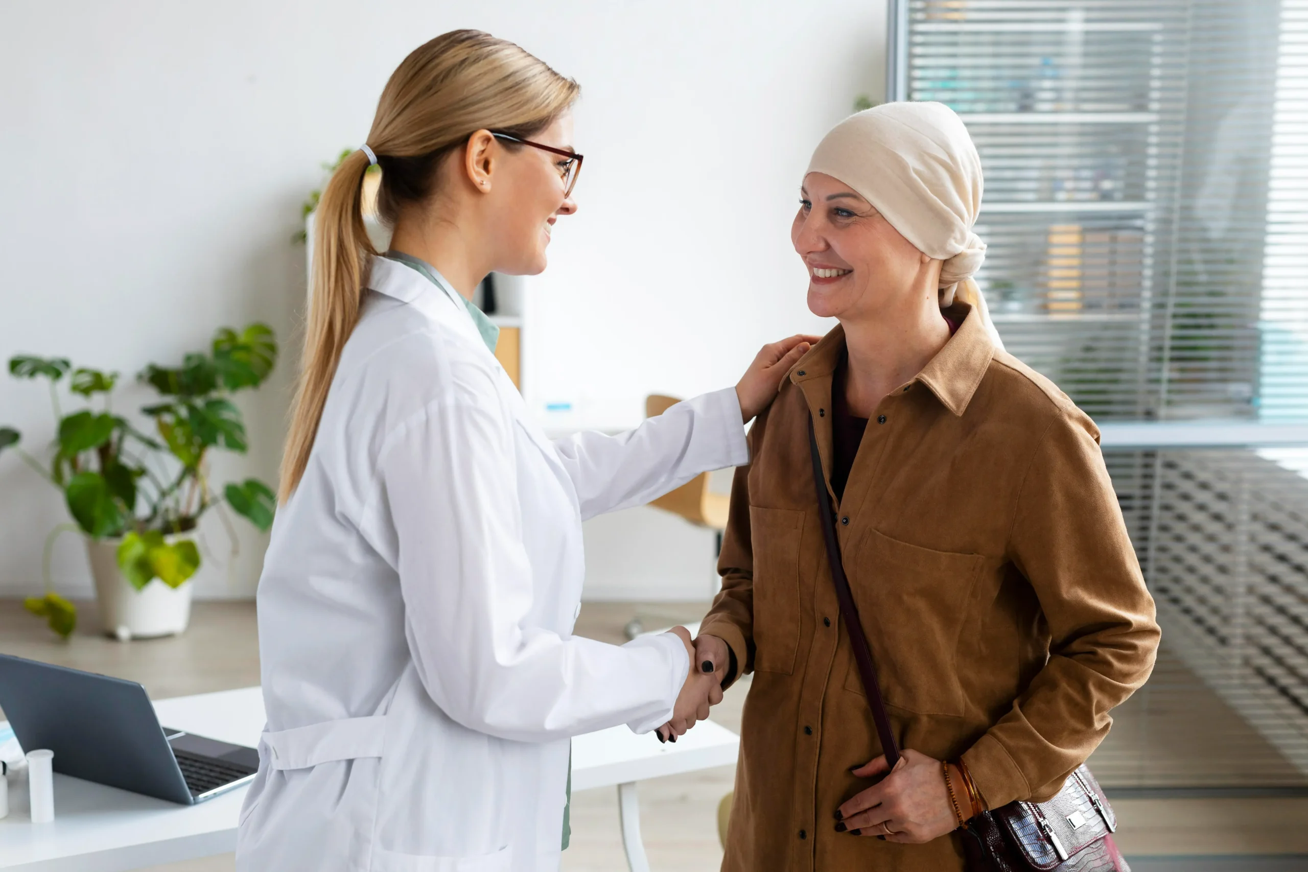 a woman shaking hands with a woman